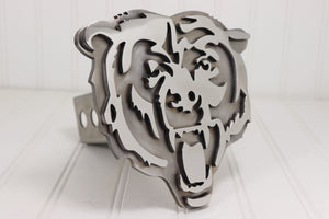 Metallic tiger head design on a white background